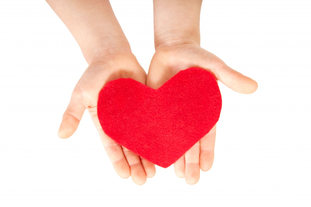 Children hands giving heart. Love concept.
