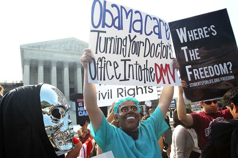 WASHINGTON, DC - JUNE 28:  Anti-Obamacare protesters wear masks of U.S. President Barack Obama and Grim Reaper as they demonstrate in front of the U.S. Supreme Court June 28, 2012 in Washington, DC. The Supreme Court is expected to hand down its ruling on the Affordable Healthcare Act this morning.  (Photo by Alex Wong/Getty Images) ORG XMIT: 147176263